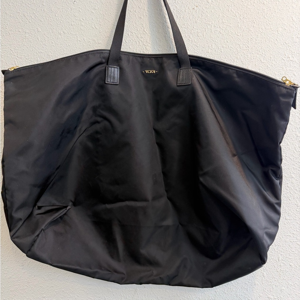 Large Tumi Black Nylon Tote with Gold Hardware Accents. Only bag. No pouch.
